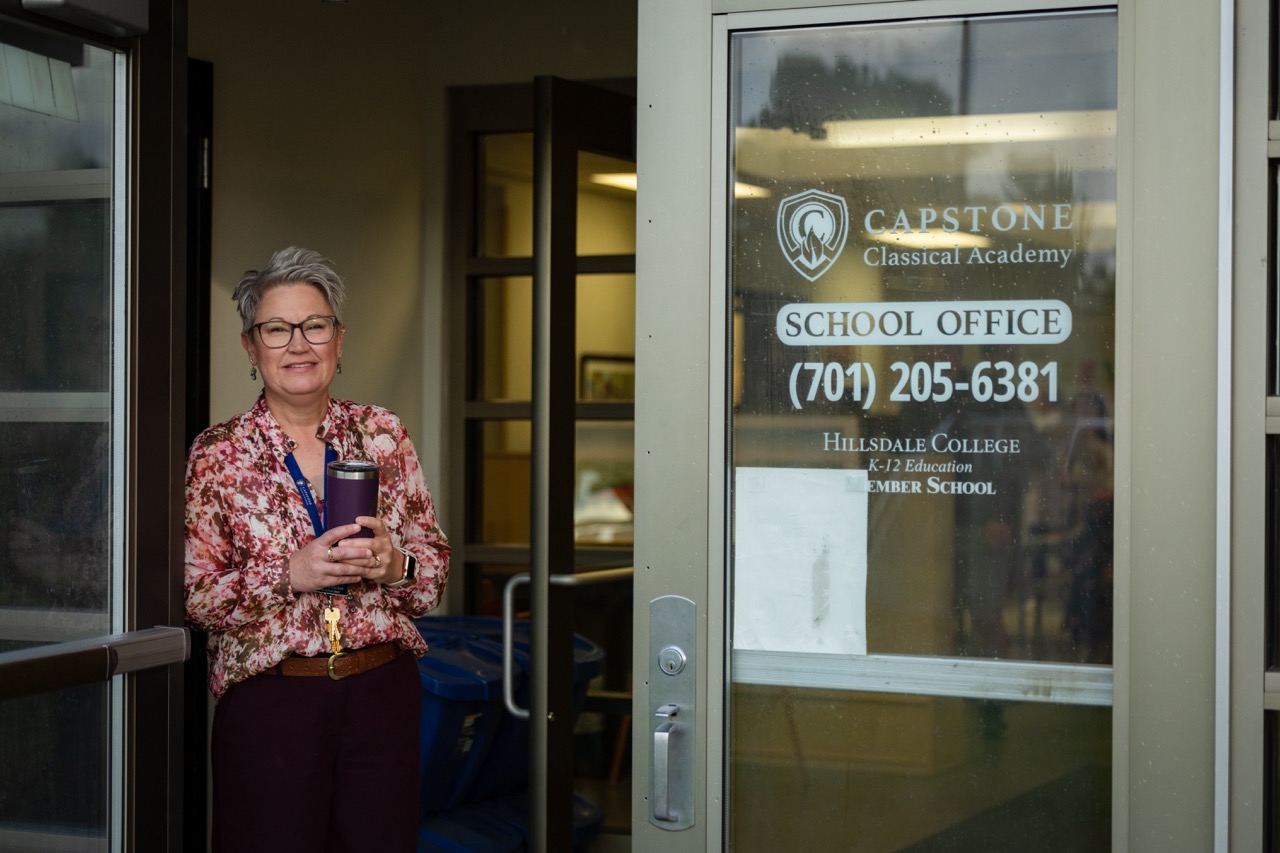 Teacher standing in doorway